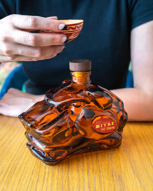 Mezcal paired with seafood and meat dishes for balanced land and sea flavors.